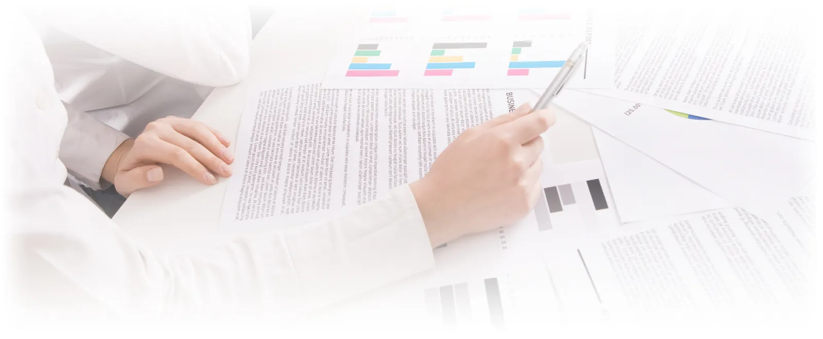 Analyzing paperwork at a desk